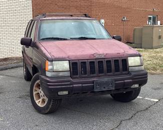 1996 Jeep Grand Cherokee VIN: 1J4GZ78Y9TC212836 Miles: 182443 Engine: 5.2 Color: BURGUNDY 1996 Jeep Grand Cherokee 5.2 Liter 4x4. Mileage 182,443 Power Accessories, Reese Hitch, Wired For Trailer. Has Signs Of Wear And Repair To Interior And Fading Paint Due To Age. Clean Title
