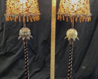 2 METAL PALM TREE CANDLESTICK LAMPS THESE HEAVY METAL CONSTRUCTED LAMPS FEATURE BEADED METAL LAMP SHADES. NO SHIPPING PICKUP ONLY