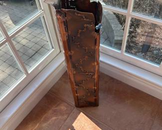 Artistic copper umbrella stand. 