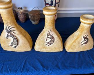 Kokopelli design urns.