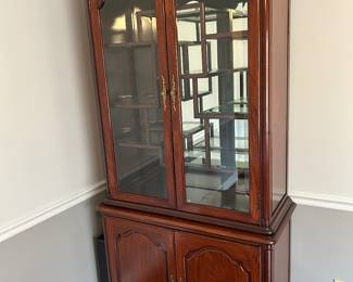 China cabinet with Asian treatment.