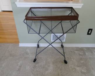 Rolling laundry cart. Or would make a great rolling toy picker-upper for the kiddos