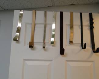 An assortment of over the door hangers. Not to be confused with over the shoulder boulder holders