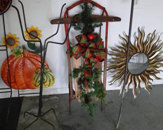 Vintage sled with decorations, and a sunburst mirror