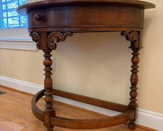 R22 - $325. English Entry Demi Lune Table. Measures 36" wide x 18" deep x 30" tall. Single Drawer slides easily. Purchased in England 80's/90's. ("Half Moon Oak Table" written on antique store tag.) 