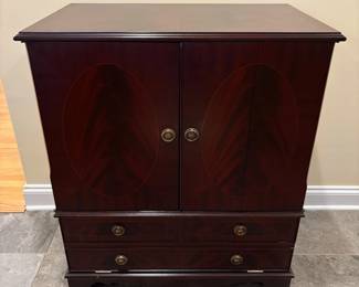 R41 - $95. Vintage TV Cabinet. Measures 30" wide x 18.75" deep x 35" tall. Top doors open. Bottom folds down and has a pull out tray. Would work for a record cabinet Doors are flamed wood with inlay. 