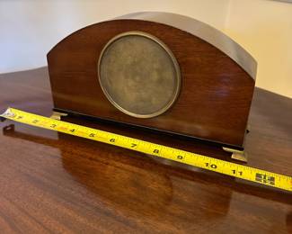 R80 - $75. Satinwood Mantle Clock with 4 brass feet. WORKS! French Movement. Measures 9.5" wide x  3" deep x  5.5" tall. 