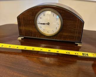 R80 - $75. Satinwood Mantle Clock with 4 brass feet. WORKS! French Movement. Measures 9.5" wide x  3" deep x  5.5" tall. 