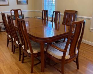 R1 - $850. Excellent Condition - you will not find a set in better condition! Rosewood Dining Table with 8 Chairs. Measures 42" wide x 60" long with NO leaves. Includes 2 that are 17.75" each. 6 Side Chairs are 17.75" wide x 18" deep x 42" tall. 2 Arm Chairs are 21.75" wide x 20" deep x 42" tall.  Floor to seat of chairs is 16.75". Very comfortable chairs!