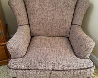 R6 - $125. Upholstered Wingback Armchair in a light brown tweed-style fabric with dark brown piping. On Wheels. Excellent Condition! No brand / tags. Measures 37" wide x 34" deep x 34" tall. 