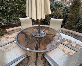 R51 - $75. Swivel Chairs & Glass Top Table are in fair condition. Some surface rust and chairs are starting to wear. Umbrella is in great condition. Will get you through the summer!