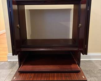 R41 - $95. Vintage TV Cabinet. Measures 30" wide x 18.75" deep x 35" tall. Top doors open. Bottom folds down and has a pull out tray. Would work for a record cabinet Doors are flamed wood with inlay. 
