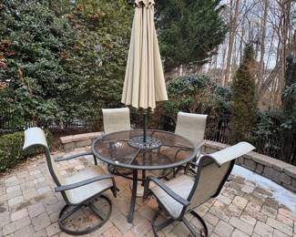 R51 - $75. Swivel Chairs & Glass Top Table are in fair condition. Some surface rust and chairs are starting to wear. Umbrella is in great condition. Will get you through the summer!