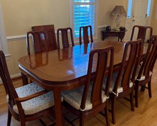 R1 - $850. Excellent Condition - you will not find a set in better condition! Rosewood Dining Table with 8 Chairs. Measures 42" wide x 60" long with NO leaves. Includes 2 that are 17.75" each. 6 Side Chairs are 17.75" wide x 18" deep x 42" tall. 2 Arm Chairs are 21.75" wide x 20" deep x 42" tall.  Floor to seat of chairs is 16.75". Very comfortable chairs!