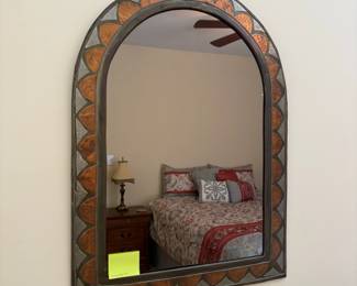 R10 - $55. Arched Decorative Wall Mirror with Copper & Silver-Toned Metalwork Details. Measures 16" x 21" tall. Excellent Condition. 