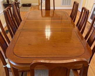 R1 - $850. Excellent Condition - you will not find a set in better condition! Rosewood Dining Table with 8 Chairs. Measures 42" wide x 60" long with NO leaves. Includes 2 that are 17.75" each. 6 Side Chairs are 17.75" wide x 18" deep x 42" tall. 2 Arm Chairs are 21.75" wide x 20" deep x 42" tall.  Floor to seat of chairs is 16.75". Very comfortable chairs!