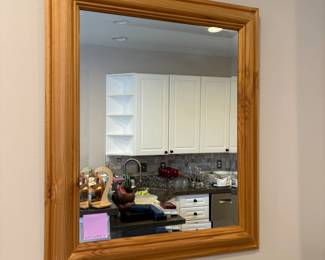 R66 - $25. Pine Framed Mirror. Measures 20.75" x 24.75". 