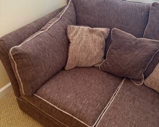R7 - $175. Brown Tweed Fabric Loveseat with Shelter Arms and Contrast Piping. On Wheels. Excellent Condition. Measures 58" wide x 35" deep x 33" tall. 