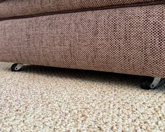 R6 - $125. Upholstered Wingback Armchair in a light brown tweed-style fabric with dark brown piping. On Wheels. Excellent Condition! No brand / tags. Measures 37" wide x 34" deep x 34" tall. 