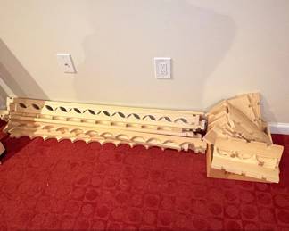 Unassembled Wooden Wine Rack Sections with Carved Wave Pattern