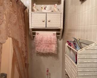 Vintage Ceramic Swan, Vintage Ceramic Duck Figurine, Clear Acrylic Toilet Brush with Floral Pink Flowers, Artificual Pink and White Floral Arrangement in a wicker basket, Decorative Pink Hand Towel