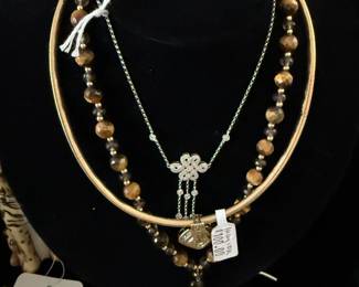 14k Diamond Knot Necklace , Precious metal pricing is subject to change based on market fluctuation.