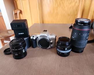 Minolta 35mm camera with 3 lenses, flash, brochures and accessories 