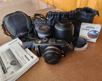 Lumix GF1 camera with 2 nice lenses, battery charger, filter and the brochures