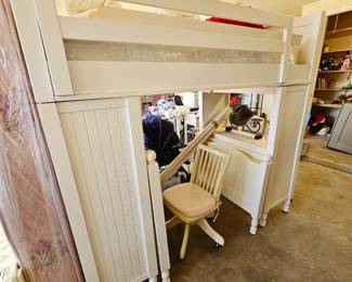 White Pottery Barn twin bunk bed with desk and extra twin size bed that can fit underneath it or be used separately. Priced as set