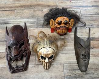 Mythic Beasts Collection of Four Carved IndoPacific Masks