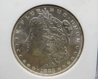 Lot 148. 1883 O Morgan Silver Dollar slabbed and graded MS 64 by GNC.