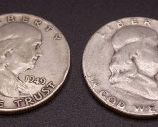 Lot 16. Two Franklin Half Dollars
