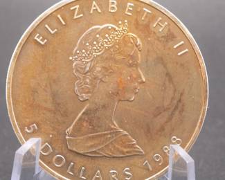 Lot 107. Canadian Maple Leaf one ounce .9999 Silver $5 toned coin