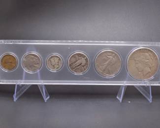 Lot 52. Six-coin type set including a Peace Silver Dollar, Walking Half Dollar, Standing Liberty Quarter, Mercury Dime, Buffalo Nickel, and Indian Head Penny