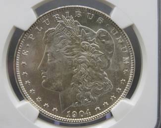Lot 145. 1904 O Morgan Silver Dollar slabbed and graded MS 64 by NGC