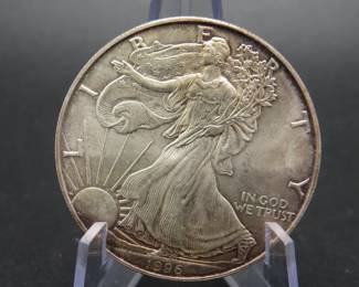 Lot 205. 1996 American Silver Eagle with toning and one ounce of .999 Silver