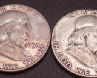 Lot 17. Two Franklin Half Dollars