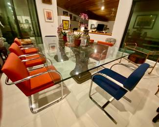 Large glass top dining table sits 12 +
Asian vases Antique
Chrome chairs 
Bar cart 