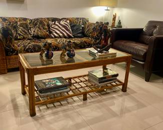 Rattan glass top coffee table decor pieces in the table not available 
Leather armchair 