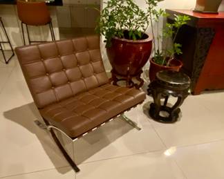 Barcelona chair 
Plant pots 
Antique small side table 