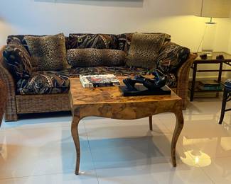 Italian Burlwood table 
Leopard pillows 
Cuban sculpture 
Wicker sofa 
