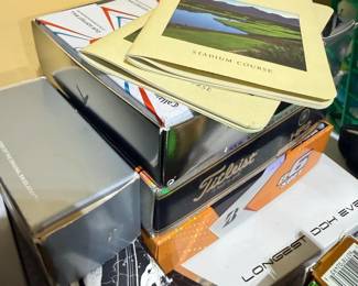 Assorted DVDs, books, and golf instructional media