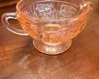 Pink depression glass cup with beaded rim