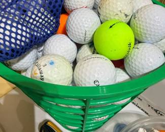 Basket of assorted golf balls