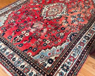 Red Persian-style hand-knotted area rug