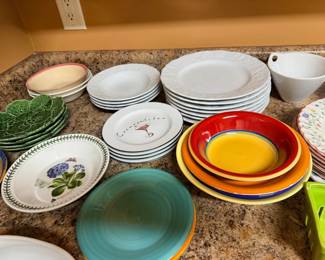 Assorted dishes, plates, and bowls, mixed patterns and colors