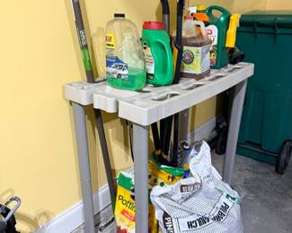 Garage shelf with cleaning supplies and lawn chemicals