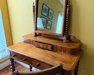 Antique vanity dresser with arched mirror and spindle supports