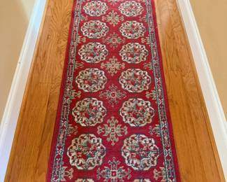 Red Persian-style hallway runner rug