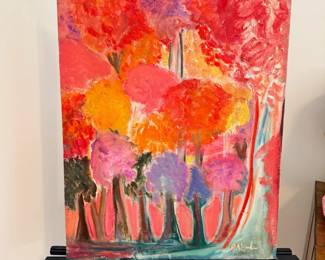 Colorful abstract floral painting on easel, pink and orange